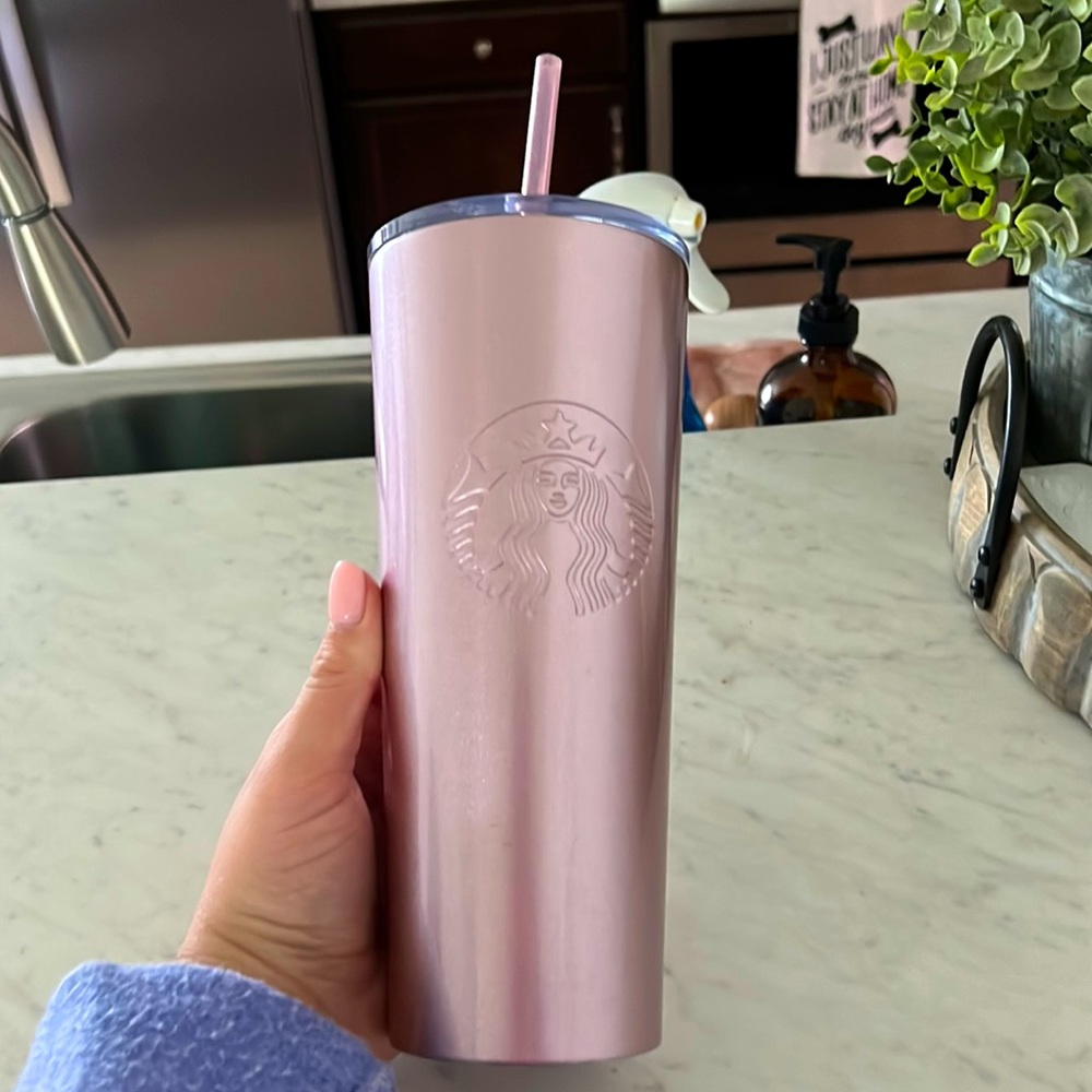 Starbucks cup, used a few times but sat in the cabinet most of the time.